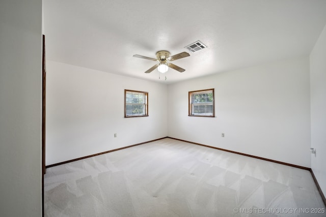 carpeted empty room with ceiling fan