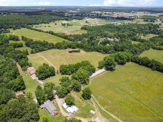 birds eye view of property featuring a rural view