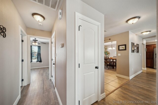 corridor featuring hardwood / wood-style flooring