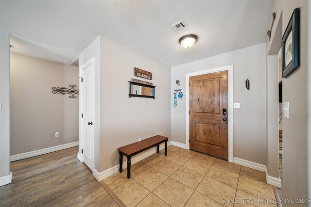 entrance foyer featuring light tile patterned flooring