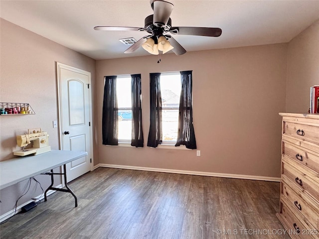 office featuring ceiling fan and dark hardwood / wood-style flooring