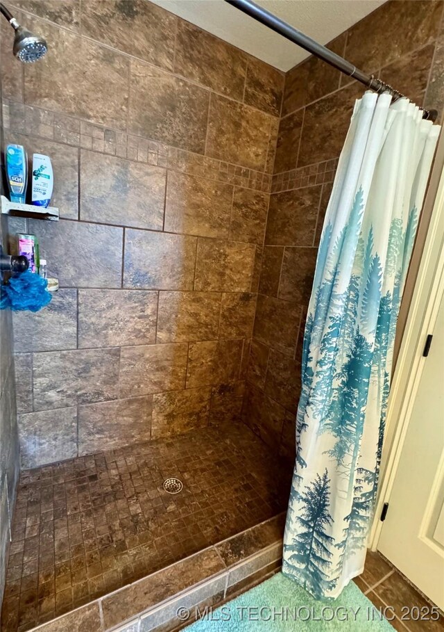 bathroom with tile patterned floors and a shower with curtain