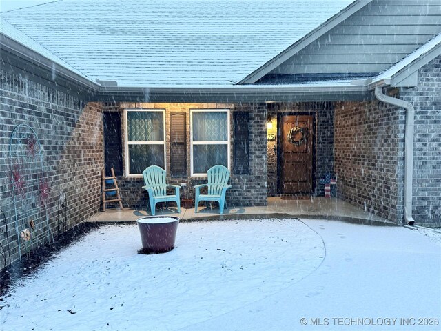 view of snow covered patio