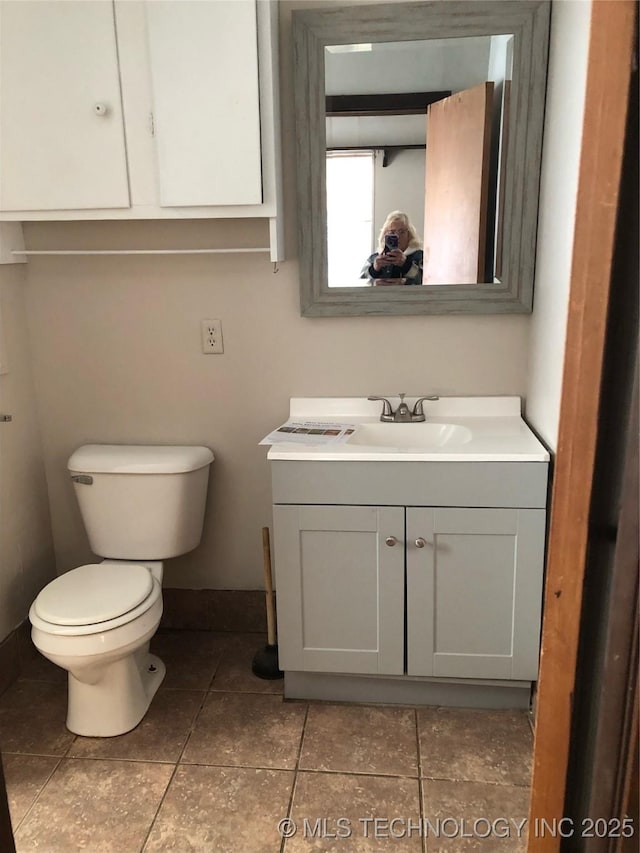 3031 N 430, Pryor, OK 74361 - half bathroom featuring toilet, tile patterned flooring, and vanity
