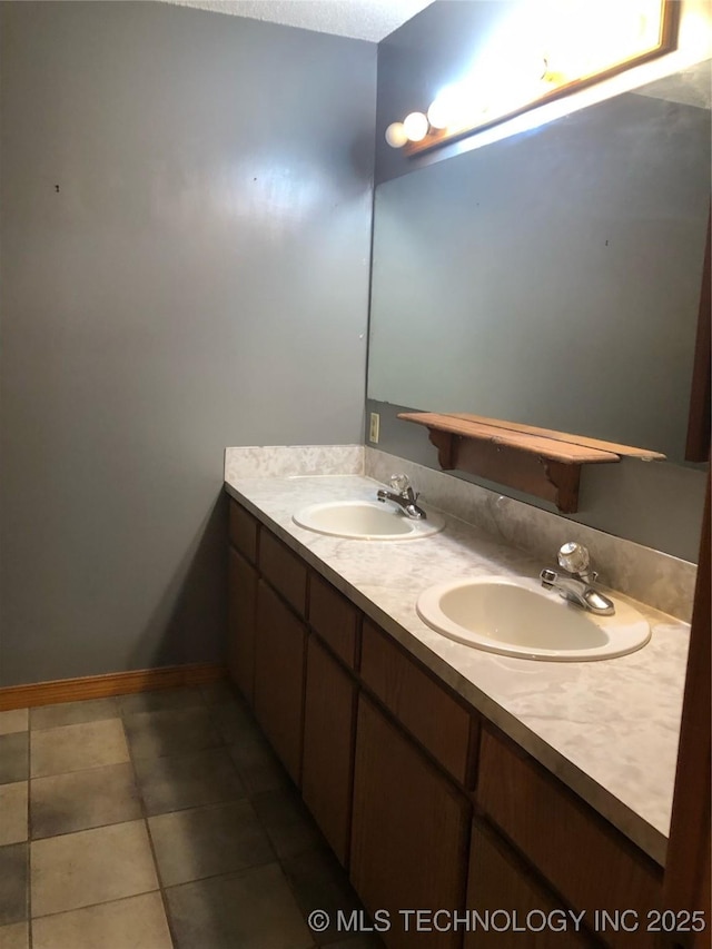 bathroom with tile patterned flooring and vanity