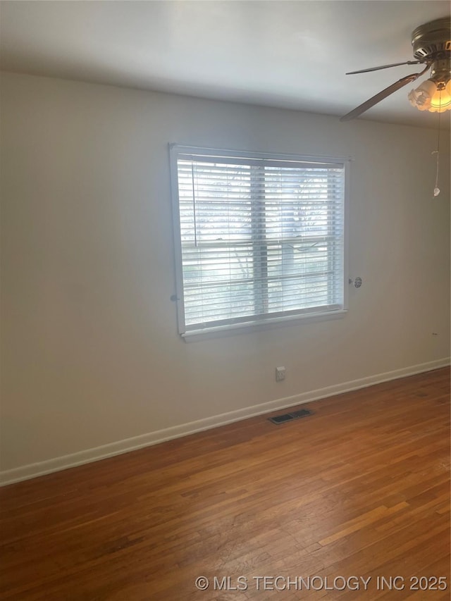 3031 N 430, Pryor, OK 74361 - empty room featuring baseboards, ceiling fan, wood finished floors, and visible vents