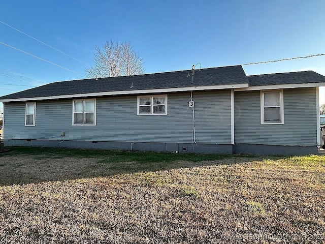 view of side of property featuring a yard