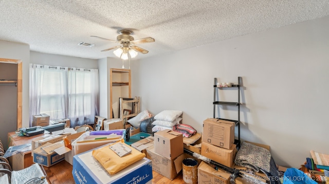 2019 Mckenzie Rd, Pawhuska, OK 74056 - interior space with a textured ceiling, light wood-style flooring, and ceiling fan
