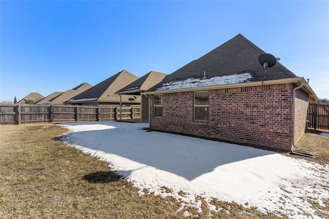 rear view of house featuring a patio area and a lawn