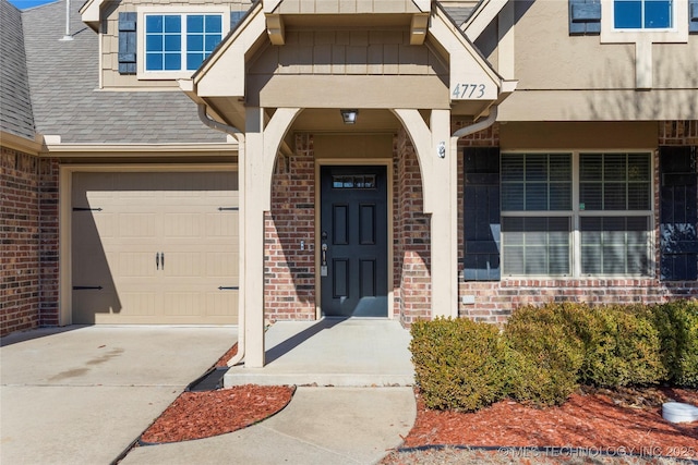 view of exterior entry with a garage