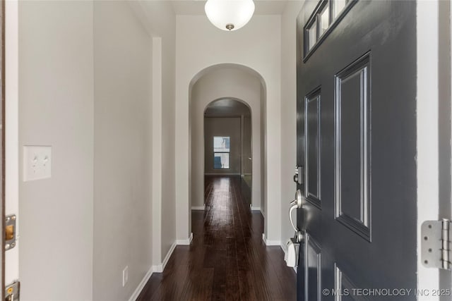 corridor featuring dark wood-type flooring