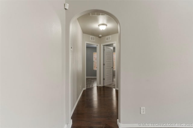 hall with dark hardwood / wood-style flooring