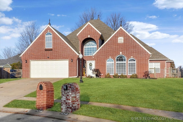 view of front of home featuring a garage and a front yard