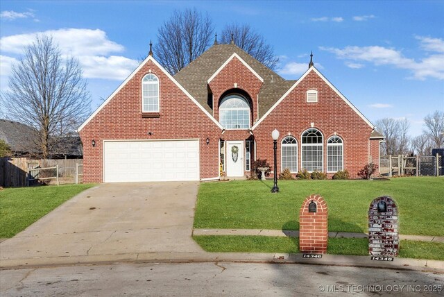 view of property with a front lawn and a garage