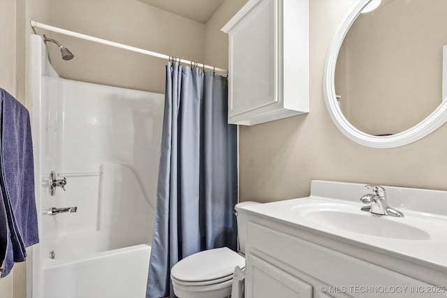 full bathroom featuring shower / tub combo, vanity, and toilet