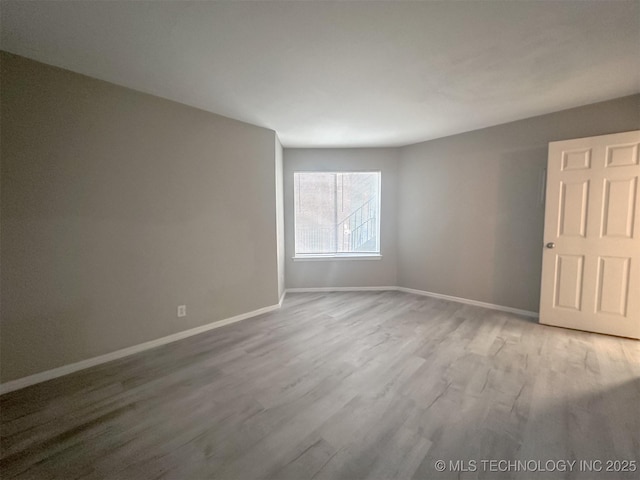 unfurnished room featuring wood-type flooring