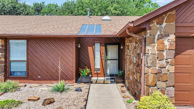 doorway to property featuring a garage