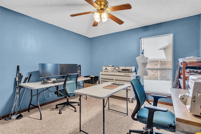 home office with a textured ceiling, ceiling fan, and light colored carpet