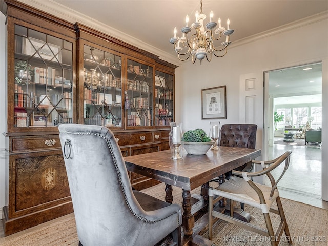 dining space featuring ornamental molding and a notable chandelier