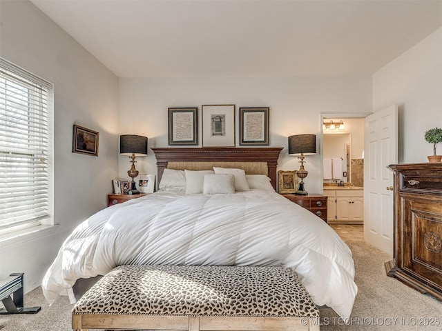 carpeted bedroom featuring ensuite bathroom