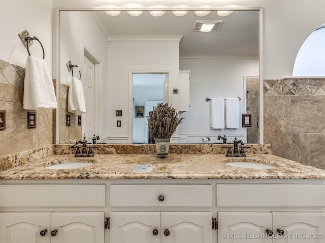 bathroom featuring vanity and crown molding