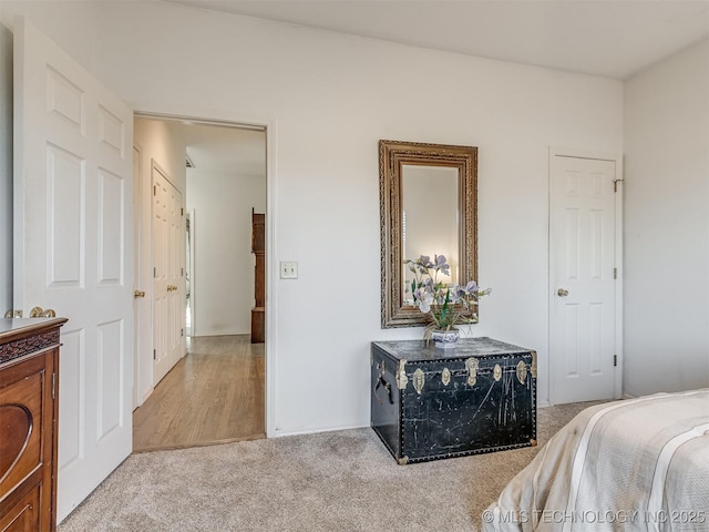 bedroom with light colored carpet