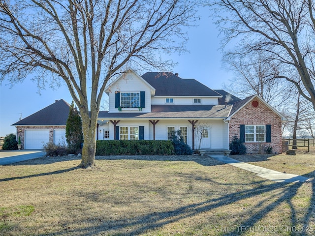 front facade with a garage and a front yard