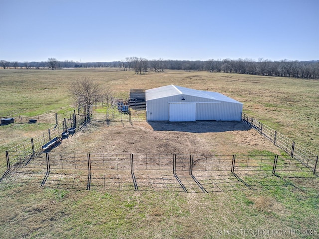 view of yard with a rural view and an outdoor structure