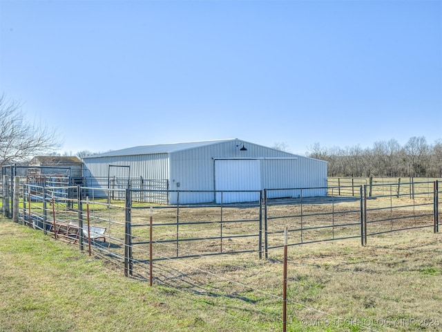 view of outdoor structure featuring a rural view