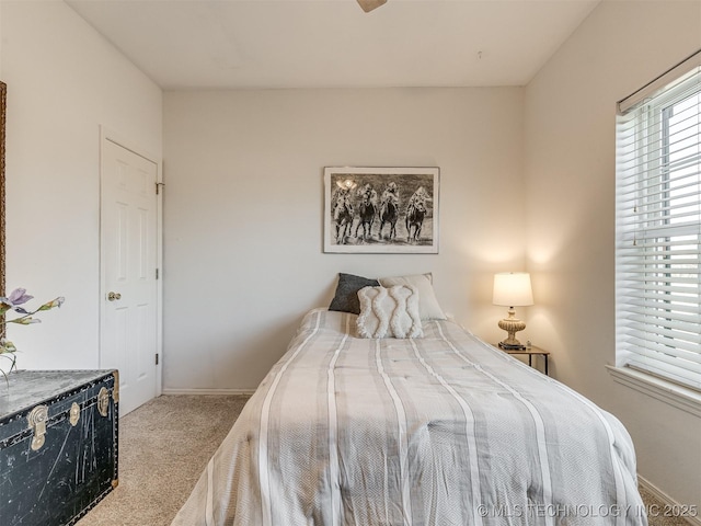 bedroom featuring light colored carpet