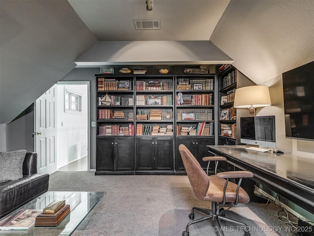 office area with lofted ceiling and carpet