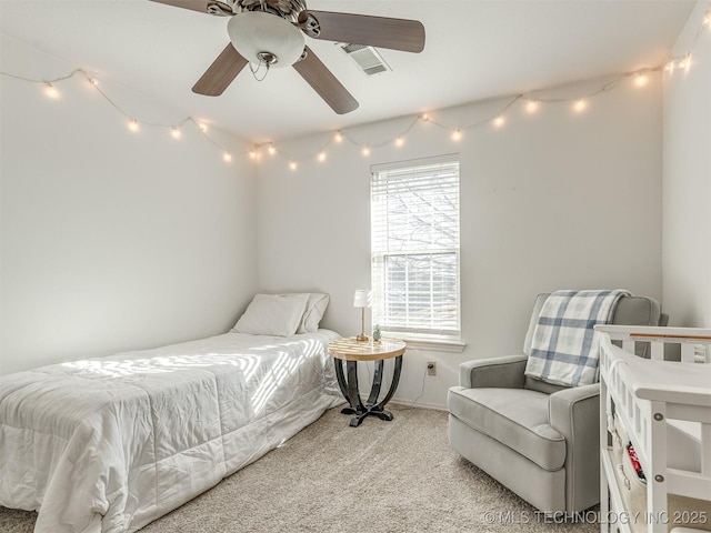 bedroom featuring ceiling fan and light carpet