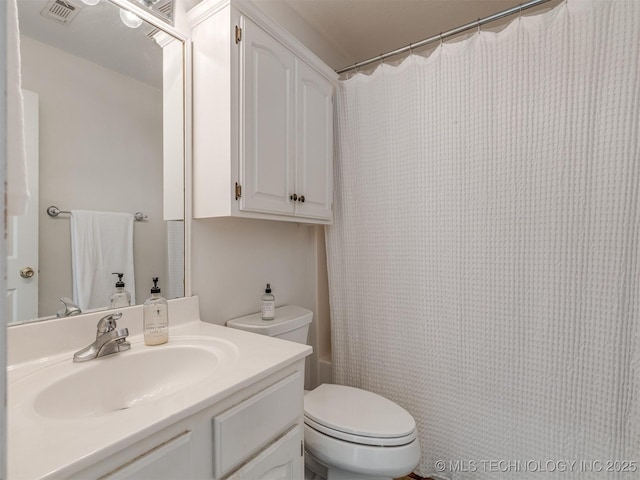 full bathroom featuring vanity, toilet, and shower / bath combination with curtain