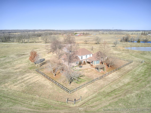 birds eye view of property with a rural view and a water view