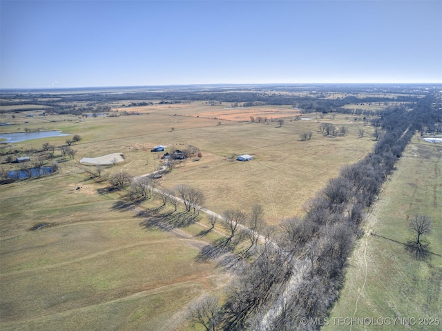 drone / aerial view featuring a rural view and a water view