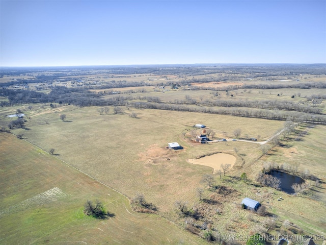 birds eye view of property with a rural view