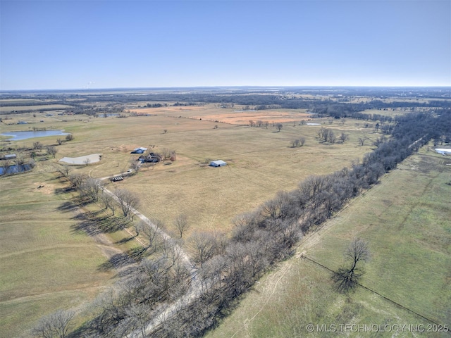 birds eye view of property featuring a rural view and a water view