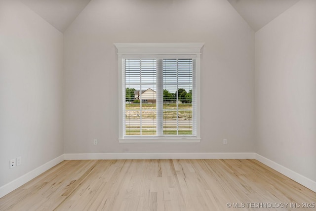 4006 S Dogwood Pl, Broken Arrow, OK 74012 - spare room featuring lofted ceiling, wood finished floors, and baseboards