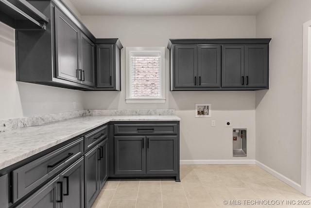 4006 S Dogwood Pl, Broken Arrow, OK 74012 - laundry area with cabinet space, hookup for a washing machine, hookup for an electric dryer, baseboards, and light tile patterned floors
