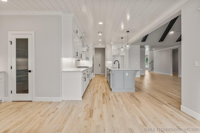 4006 S Dogwood Pl, Broken Arrow, OK 74012 - kitchen with light countertops, light wood finished floors, white cabinetry, wooden ceiling, and open floor plan