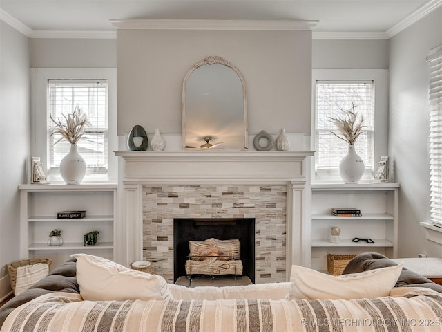 sitting room featuring ornamental molding and a fireplace