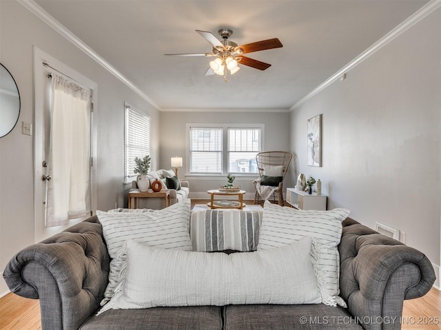 bedroom with wood-type flooring, ceiling fan, and ornamental molding