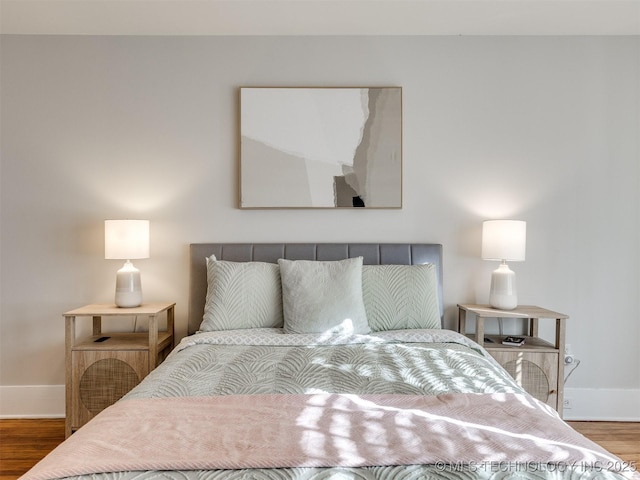 bedroom with hardwood / wood-style flooring