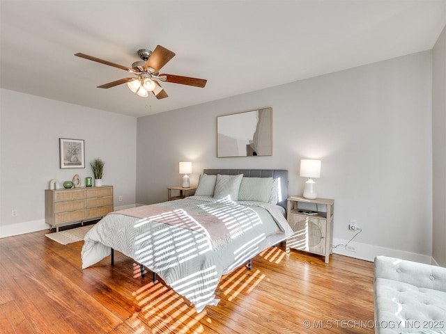 bedroom featuring ceiling fan and hardwood / wood-style floors