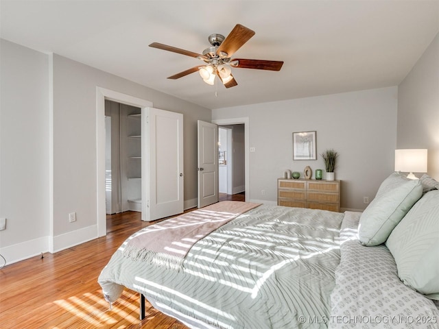 bedroom with ceiling fan and light hardwood / wood-style flooring