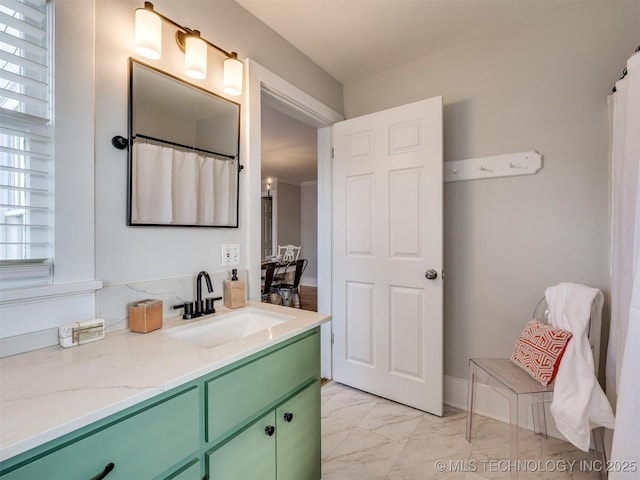 bathroom featuring vanity and a healthy amount of sunlight