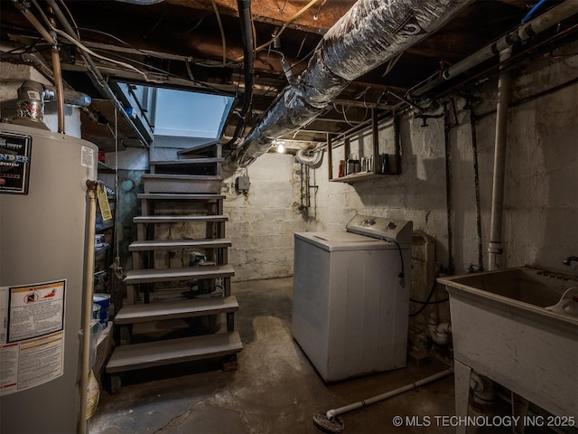 basement with sink, washer / clothes dryer, and gas water heater