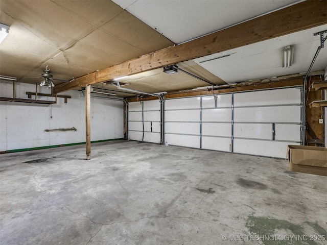 garage featuring a garage door opener and ceiling fan