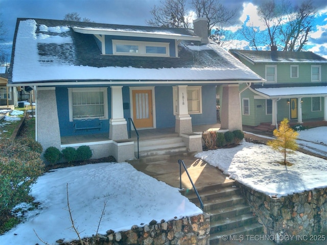 view of front of property featuring covered porch