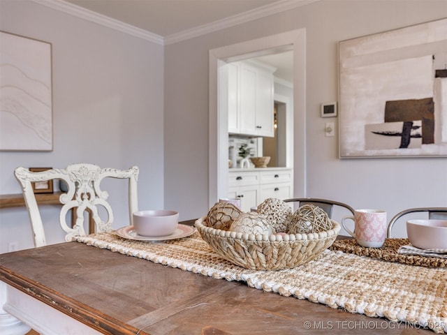 dining room featuring ornamental molding